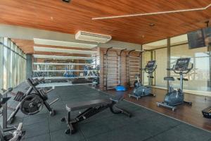 a gym with several exercise equipment in a room at Studio beach class Meireles in Fortaleza
