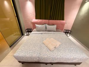 Ένα ή περισσότερα κρεβάτια σε δωμάτιο στο Capy House Taiping