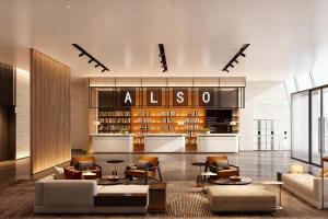 un soggiorno con molti mobili e una biblioteca di Also Hotel a Shanghai