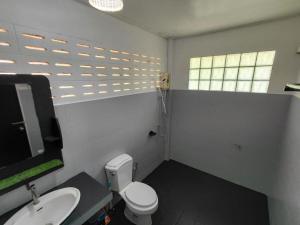 a bathroom with a white toilet and a sink at House 2 Bedroom with Seaviews near Haad Rin in Koh Phangan +34 photos