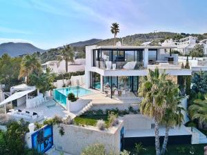 an aerial view of a villa with a swimming pool at Villa in Ibiza with Infinity Pool and Sea Views in Es Cubells