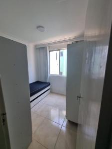 a room with a room with a bed and a window at Bem vindo ao APTO 403 in Florianópolis +11 photos