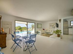 a kitchen and living room with a table and chairs at Villa in Ibiza near Talamanca Beach in Talamanca