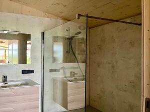 a bathroom with a sink and a shower at Group accommodation for 36 guests in Scherpenzeel +31 photos