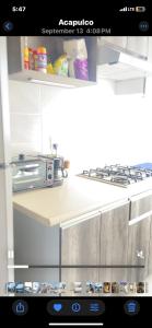 Kuchyň nebo kuchyňský kout v ubytování Puerta Al Sol Diamanté