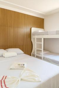 a bedroom with two bunk beds with a bow tie at Villa Hostel in Belém