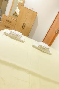 a table with two white plates on top of it at Villa Hostel in Belém