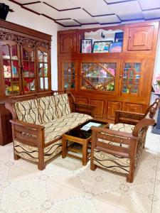 a living room with a couch and a coffee table at Baron Nilwella in Dickwella