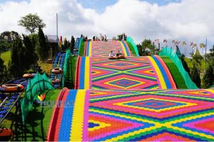 a colorful roller coaster ride at an amusement park at Dalat Peace Backpackers Hostel in Da Lat