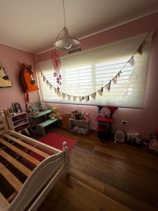 En eller flere senge i et værelse på Casa quinta en Berisso