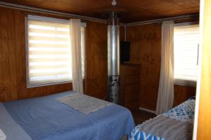 Postel nebo postele na pokoji v ubytování Cabaña y Hostal Dr Steffens