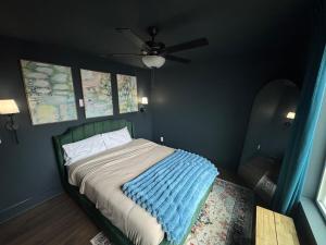 a bedroom with a bed with a ceiling fan at North Ga Hideaway in Ranger