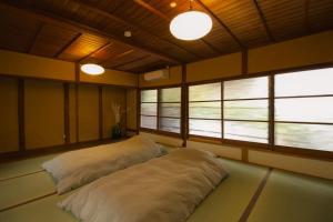 Кровать или кровати в номере ニュー檸檬樹