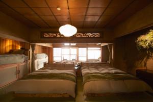 Кровать или кровати в номере ニュー檸檬樹