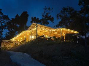 a building with lights on it at night at Laeley 1,000 miles resort in Ko Lanta Yai