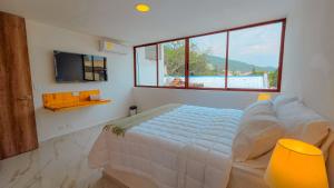 Postel nebo postele na pokoji v ubytování Riviera Hotel Boutique