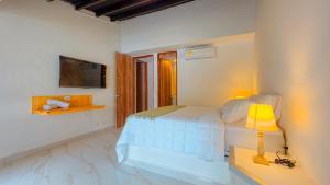 Postel nebo postele na pokoji v ubytování Riviera Hotel Boutique + 28 fotografií