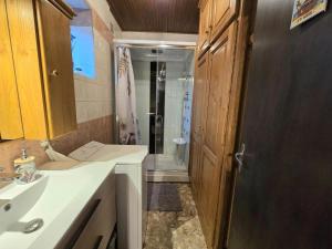 a bathroom with a sink and a shower in it at Maison de campagne confortable en Dordogne - FR-1-616-521 in Lala