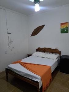 En eller flere senge i et værelse på Hostel da Passarela