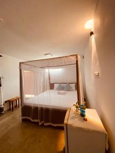 Ένα ή περισσότερα κρεβάτια σε δωμάτιο στο Lagoon Home Stay +5 φωτογραφίες