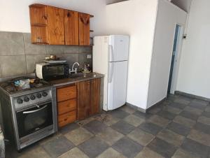 Kuchyň nebo kuchyňský kout v ubytování Complejo Cruce Varela