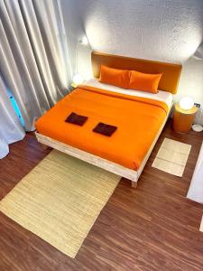 Postel nebo postele na pokoji v ubytování CenterPoint Thong Sala