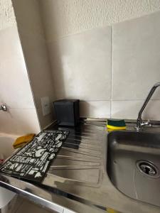 a kitchen with a sink and a stove at Prince House in Piracicaba +45 photos