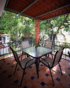 a table and chairs on a patio at Hotel Boutique Canto Del Agua in Chiconcuac