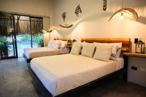 Giường trong phòng chung tại Jungla EcoLuxury Resort +19 ảnh