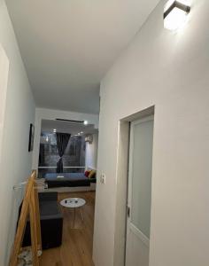 a living room with a blue couch in a room at Ha Noi Old Quarter Apartment L'Thao in Hanoi