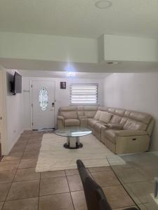 a living room with a couch and a table at Luxury&Home in Tampa