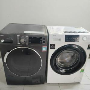 a washing machine and a dryer next to each other at Ha Noi Old Quarter Apartment L'Thao in Hanoi