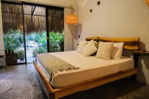 Giường trong phòng chung tại Jungla EcoLuxury Resort