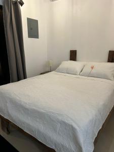 En eller flere senge i et værelse på Bungalows Chachagüita