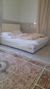 Postel nebo postele na pokoji v ubytování Quriyat