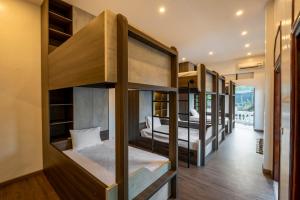 En eller flere senge i et værelse på Odyssey Hotel 2, Tours & Motorbikes Rental