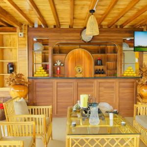 a living room with a table and chairs at Nậm Thia Homestay in Yên Bái