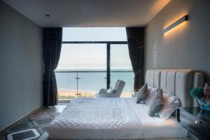 Postel nebo postele na pokoji v ubytování Condotel CSJ Tower Vũng Tàu - Căn hộ du lịch cạnh biển + 25 fotografií