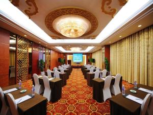 a row of tables and chairs in a banquet hall at Qingdao Chengyang Detai Hotel in Qingdao +182 photos