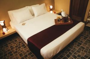 Cama ou camas em um quarto em Punta Sal Bungalows