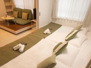 Postel nebo postele na pokoji v ubytování 桜の川50 東京晴空塔10分钟本所吾妻橋駅5分钟5人房丨 Tokyo skytree 10 mins Honjo Azumabashi 5 minutes5 people