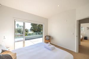 Postel nebo postele na pokoji v ubytování Paradise on Palm - Stay Waiheke + 22 fotografií