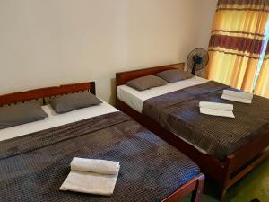 Кровать или кровати в номере Serendib House - Sinharaja