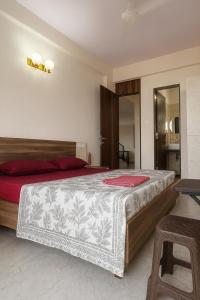 Ένα ή περισσότερα κρεβάτια σε δωμάτιο στο Hemgiri - 6BHK Pool Garden Luxury Villa Girivan Mulshi near Pune Mumbai