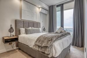 En eller flere senge i et værelse på Stormside at Ellipse