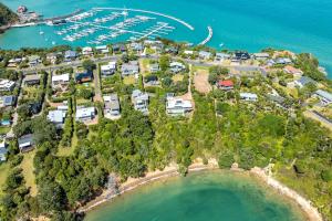 an aerial view of a resort with a marina at Black Cottage - Stay Waiheke in Waiheke Island
