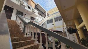 a stairway in a building with a building at El hostal de Uriel in Izalco