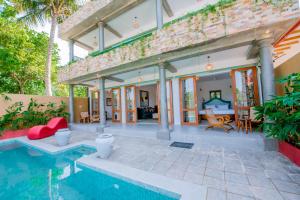 a villa with a swimming pool and a house at Sithagi River Front Villa Weligama in Weligama