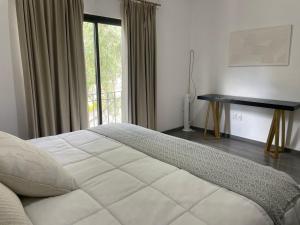 En eller flere senge i et værelse på 3BR Patio, Pool, Free Shuttle Centro San Miguel + 15 billeder