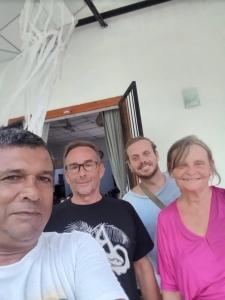 a group of people posing for a picture at Neem safari lodge Yala in Tissamaharama